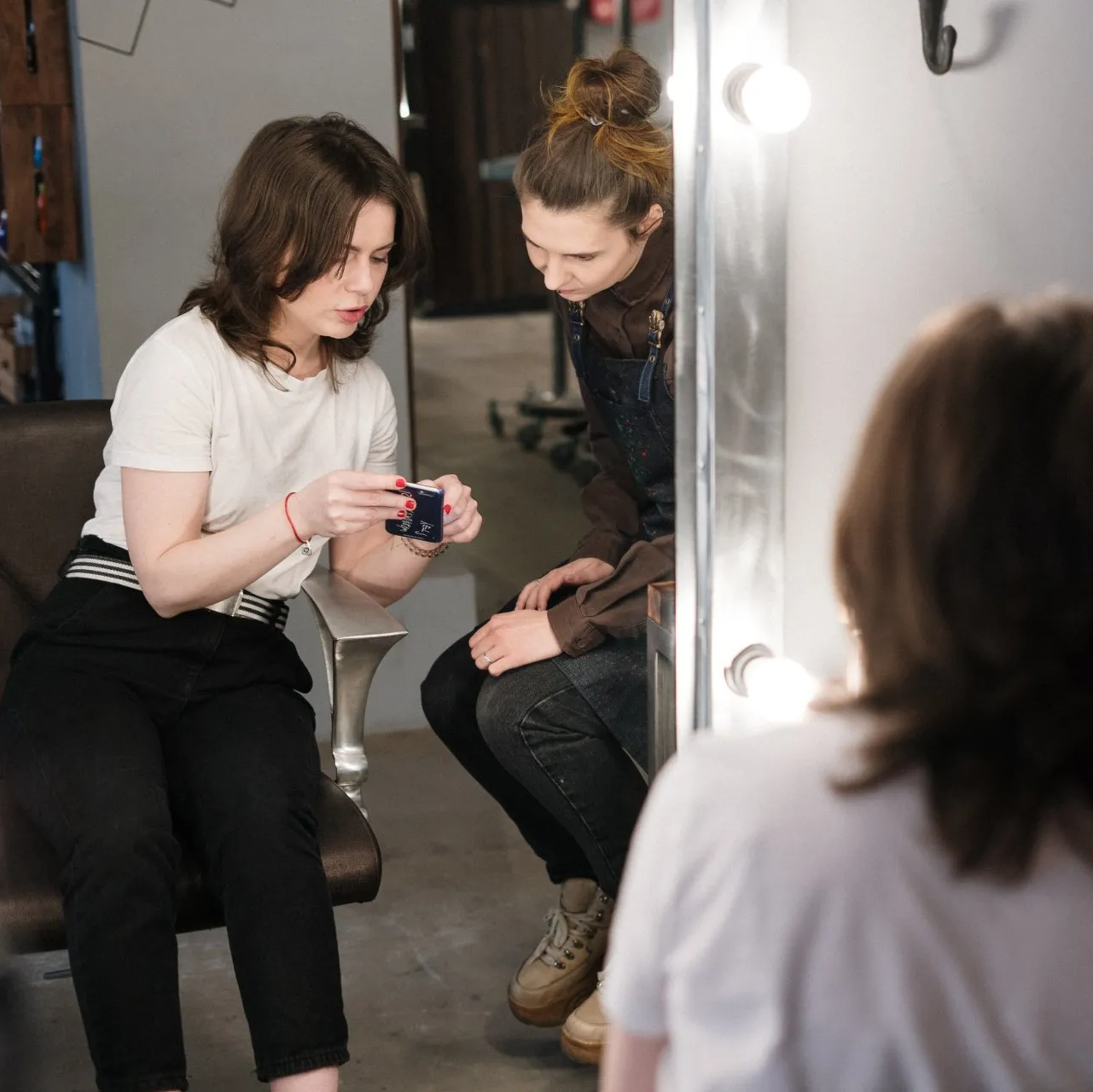 Two Women In Front Of A Mirror — Liquid Hair Salon — East Brunswick, NJ