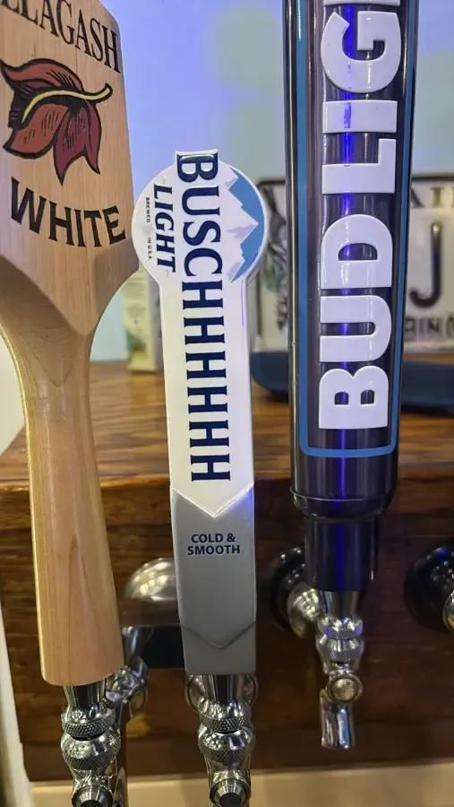 A row of beer taps including bud light and bud light white.