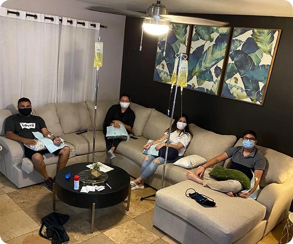 Two men are sitting next to each other in a hospital bed.