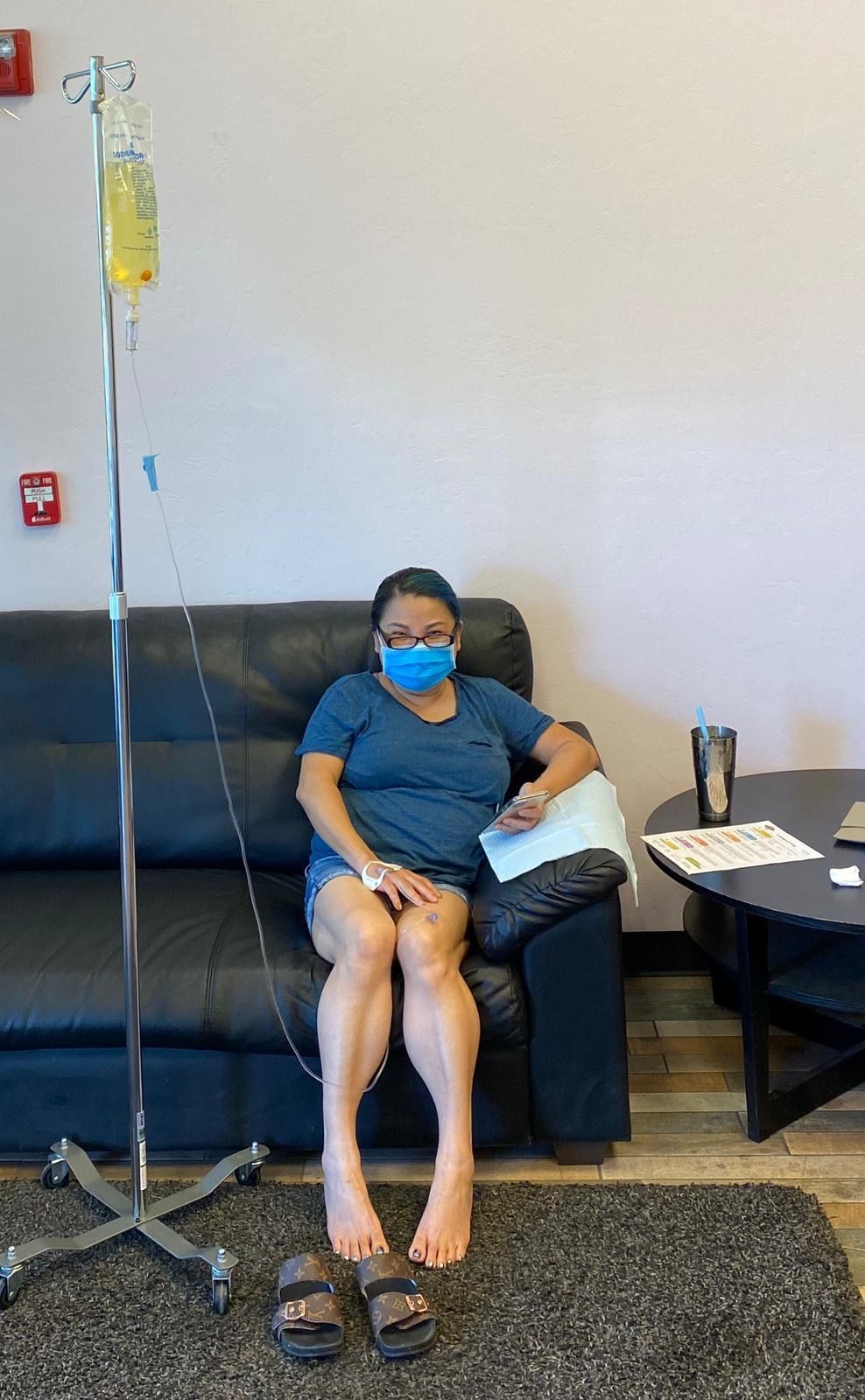woman sitting on the couch iv therapy