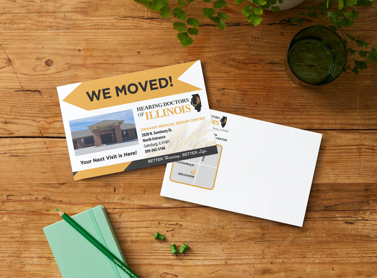 Two postcards on a wooden surface, one displaying 