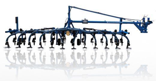 Blue agricultural tillage machine with multiple black tines on a white background