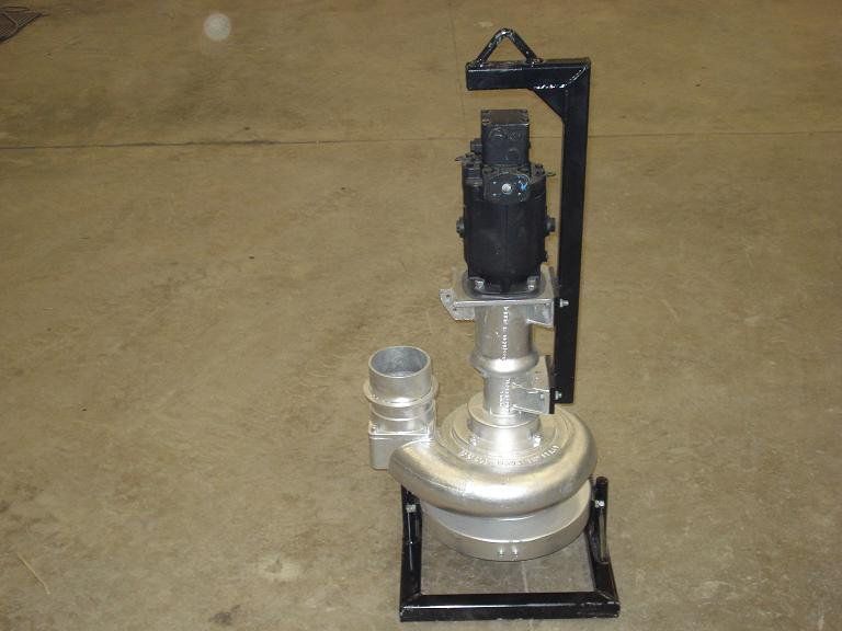Small industrial pump assembly on a metal frame, shown on a concrete floor.