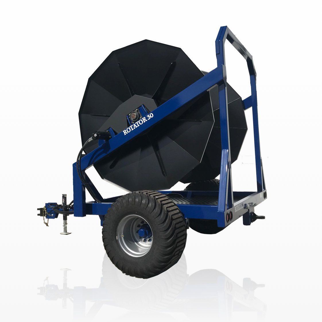 Blue agricultural hose reel trailer with large black reel and oversized tire