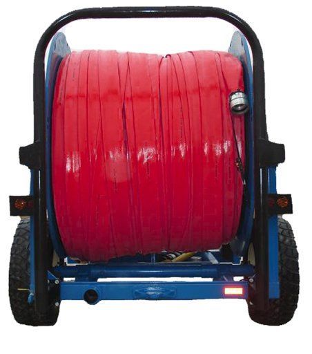 A large red hose reel mounted on a blue wheeled cart