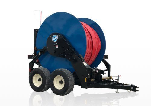 Large blue hose reel on a trailer with red hose and black frame, shown on a white background