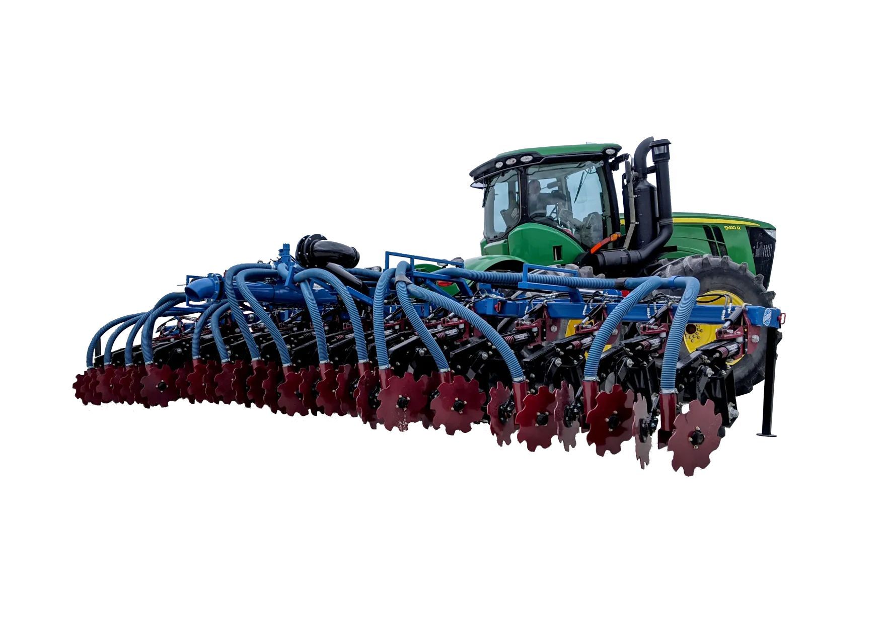 Large blue agricultural seeding machine with red tines on a white background