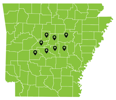 Light green map of Arkansas with eight black location pins clustered in the central region of the state.