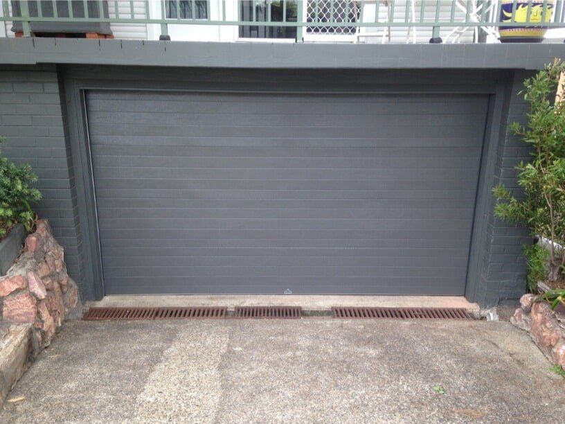 Impact Damaged Tilt Door - After — Garage Doors in Port Macquarie, NSW