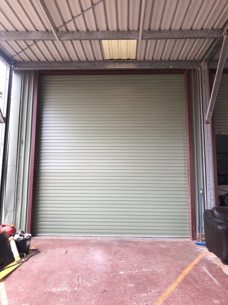 Industrial Roller Door In Pale Eucalypt Colourbond — Garage Doors in Port Macquarie, NSW