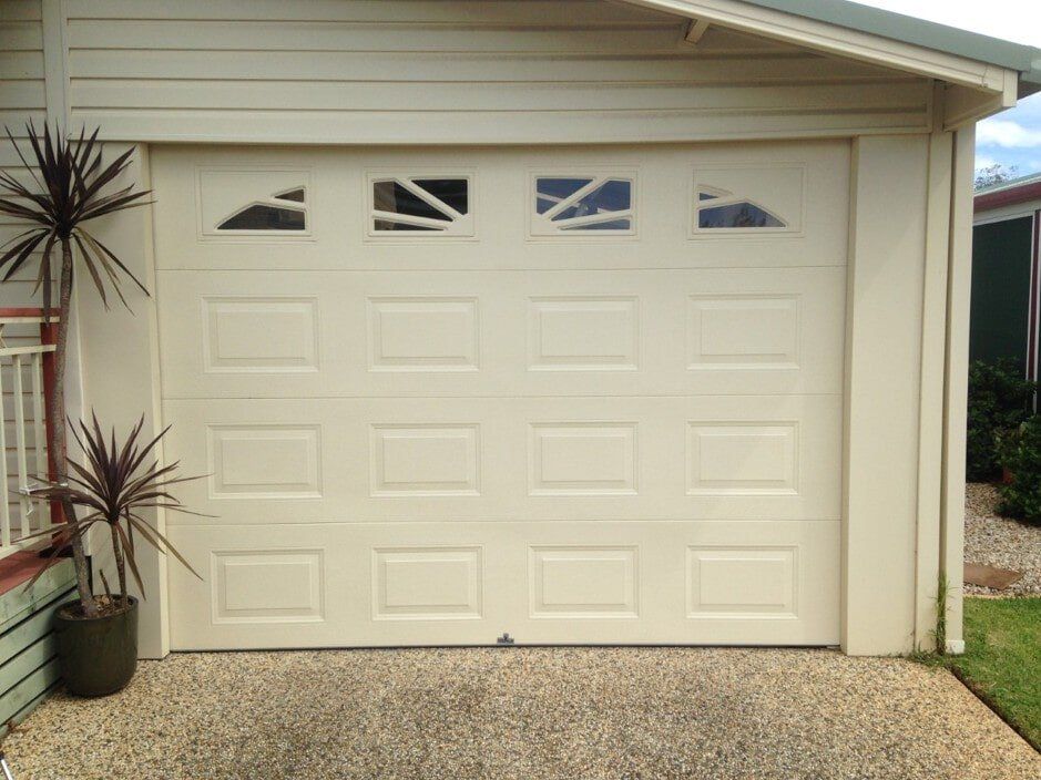 Oxford Style Panelift With Windows On A Carport Opening — Garage Doors in Port Macquarie, NSW
