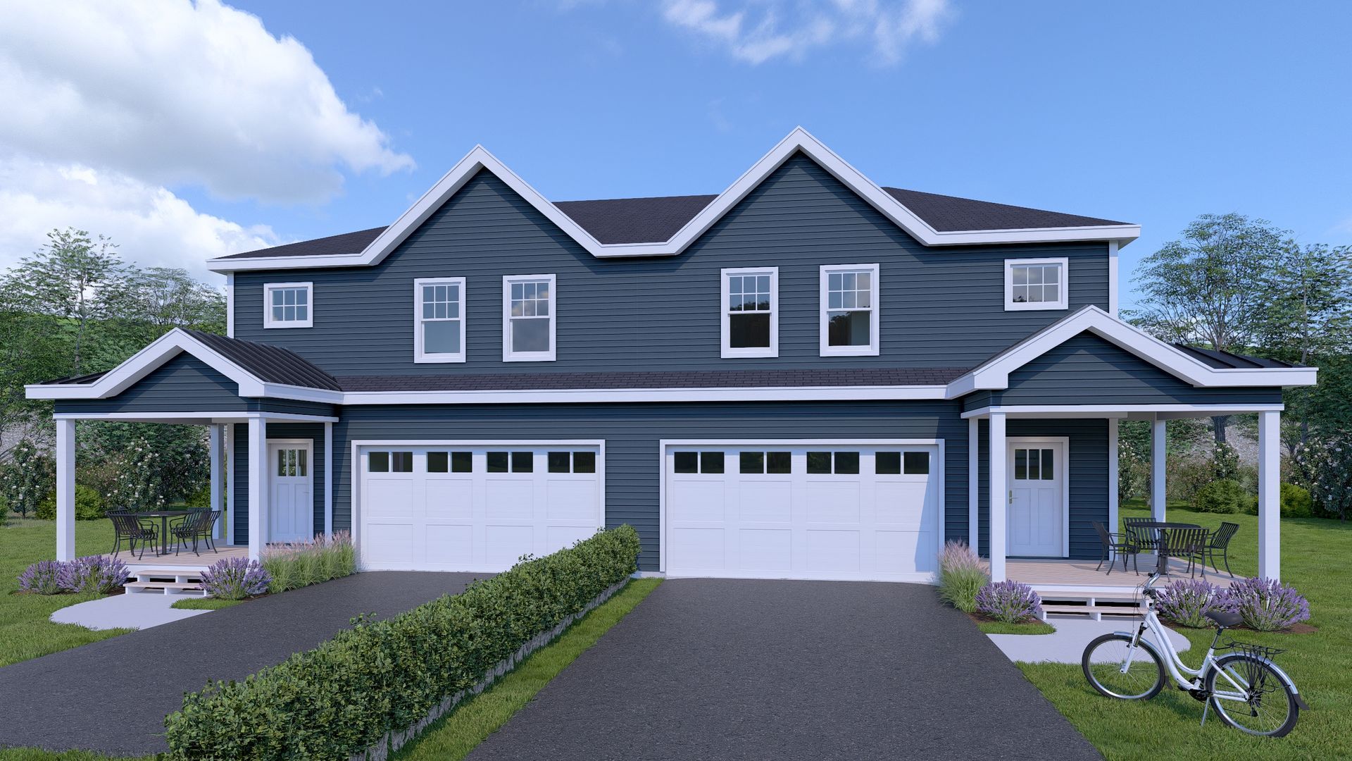 Two-story duplex with dark blue siding, white trim, and two-car garages under a blue sky.