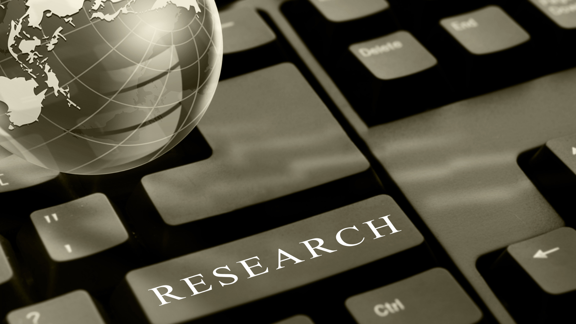 A keyboard with the word research written on it