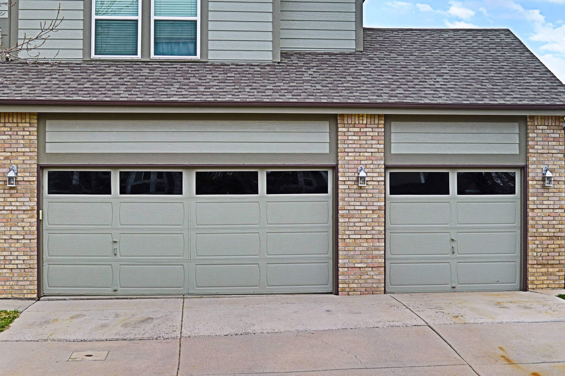 Denver garage door spring repair Family holding hands walking trail evergreen trees fog