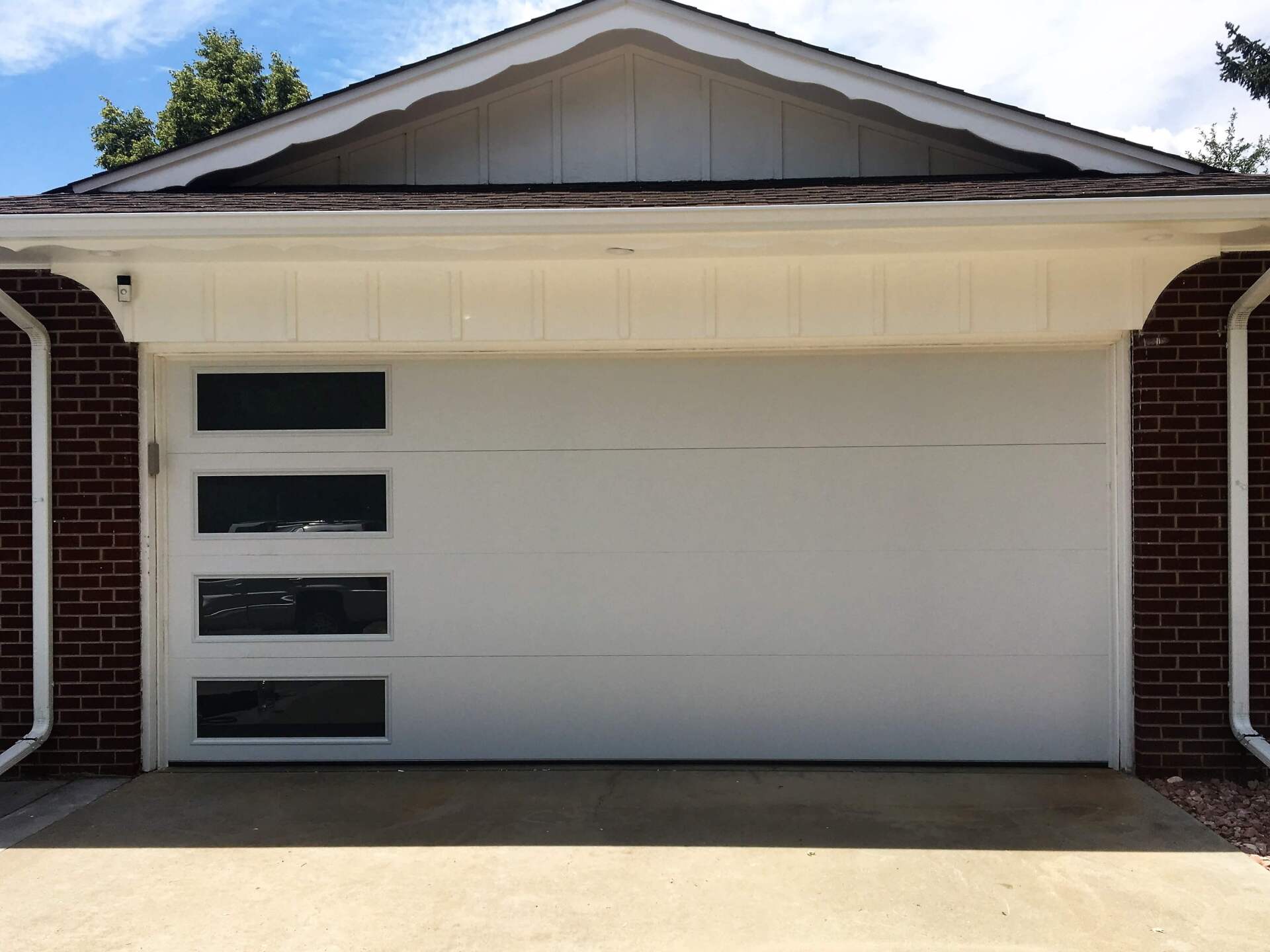 Denver garage door spring repair Family holding hands walking trail evergreen trees fog