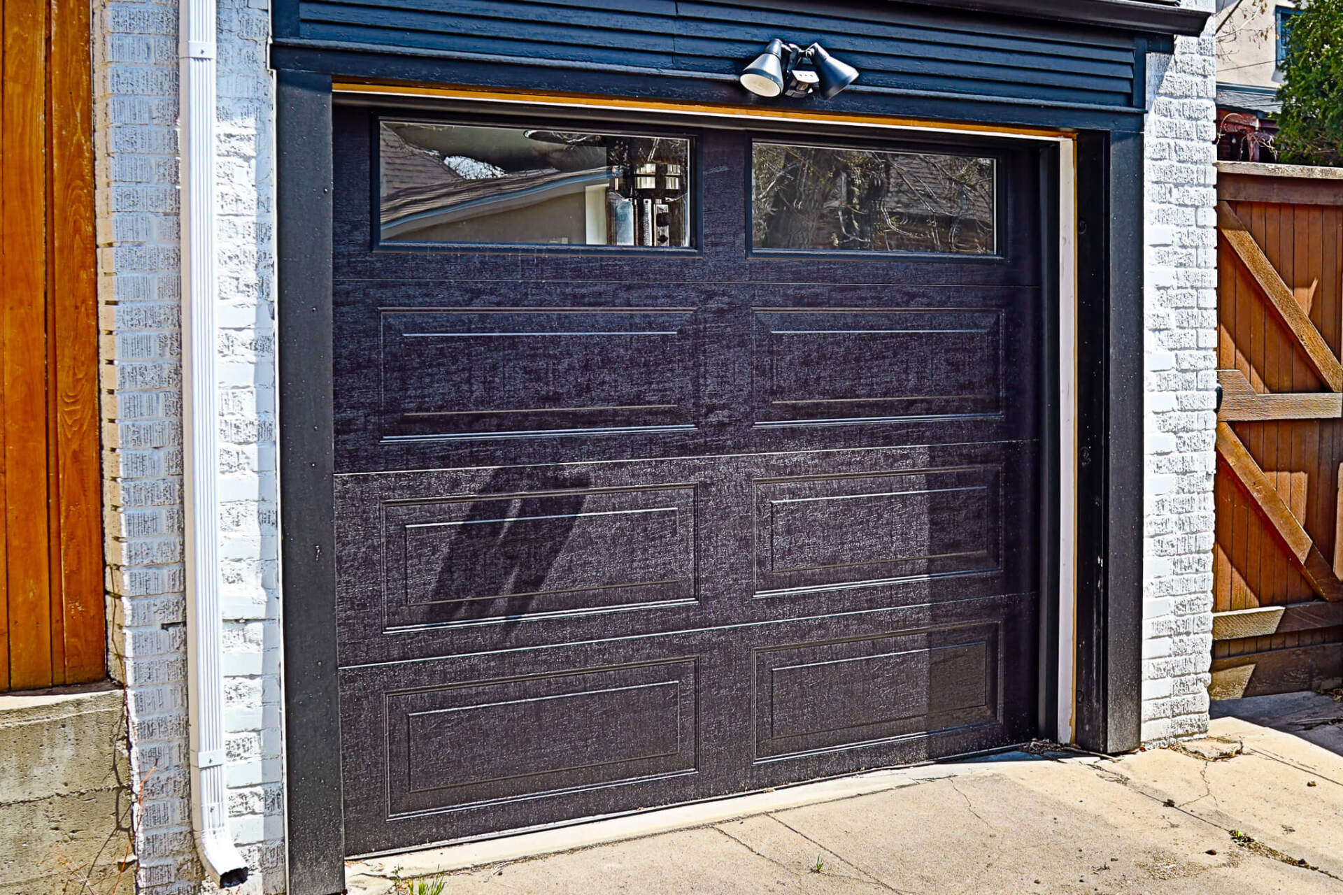 Denver garage door spring repair Family holding hands walking trail evergreen trees fog