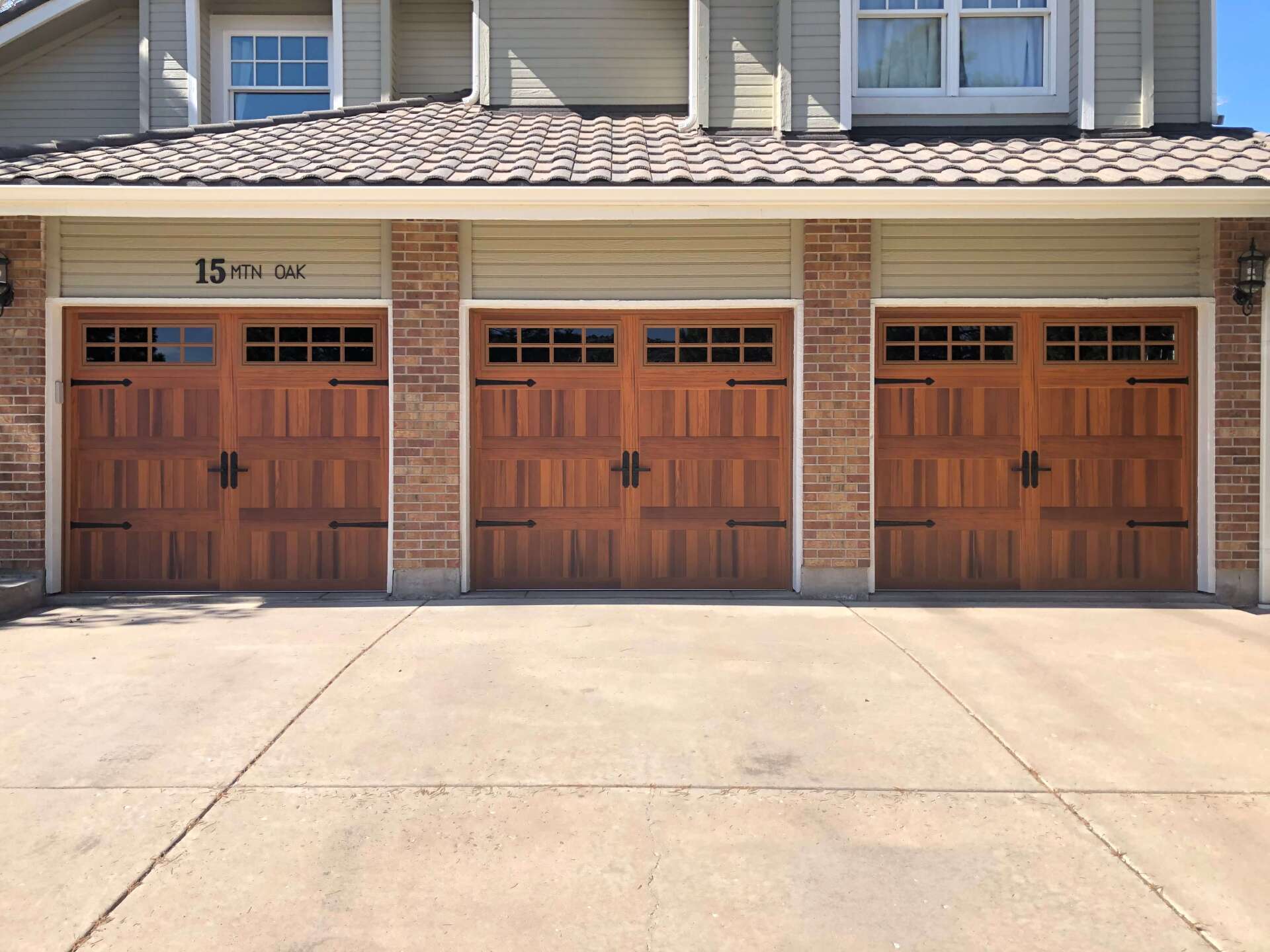 Denver garage door spring repair Family holding hands walking trail evergreen trees fog