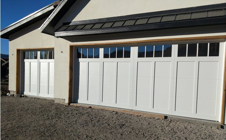 Denver garage door installation Blond woman smiling wearing red sun dress with two young boys portrait