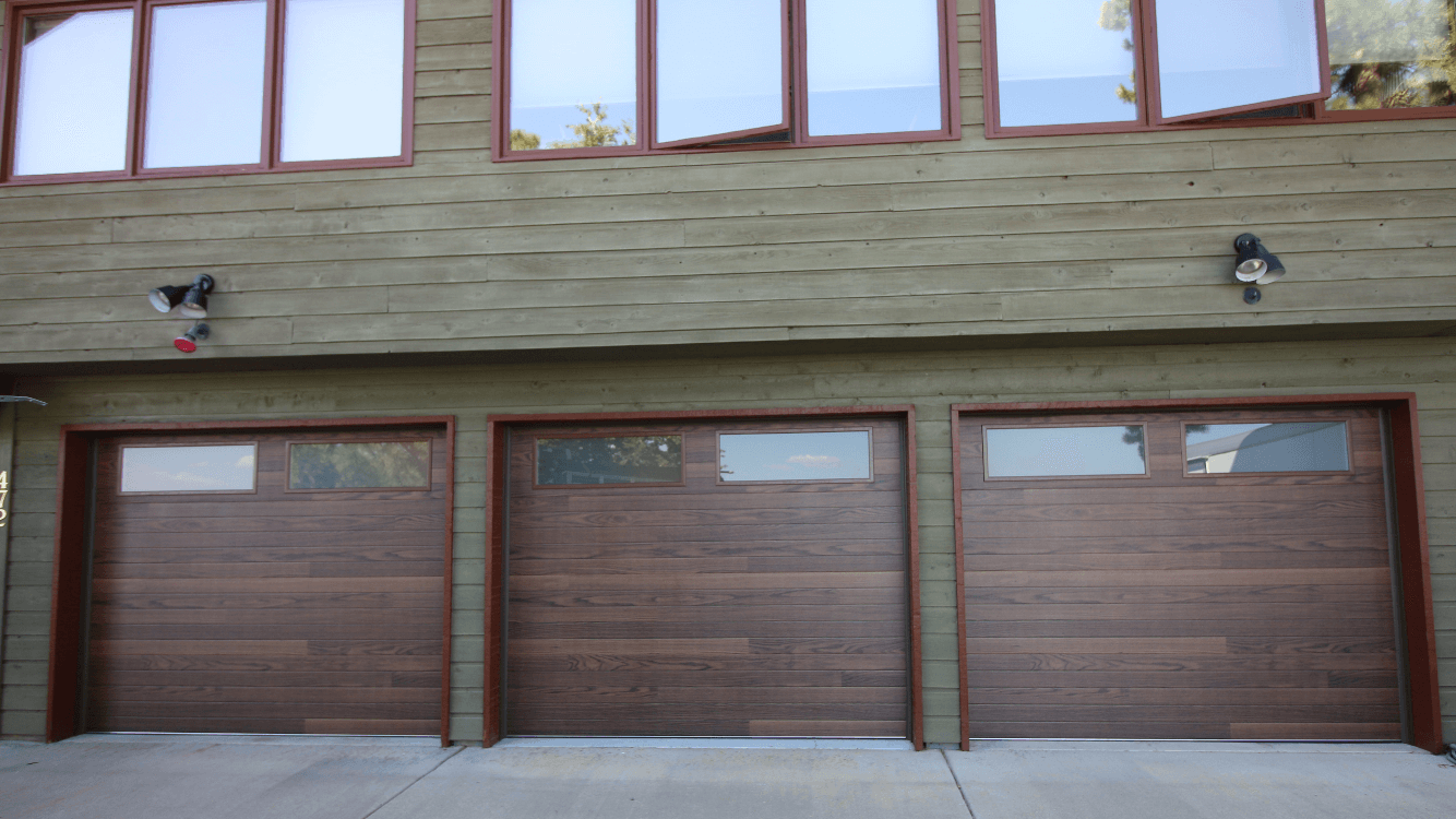 Denver garage door spring repair Family holding hands walking trail evergreen trees fog