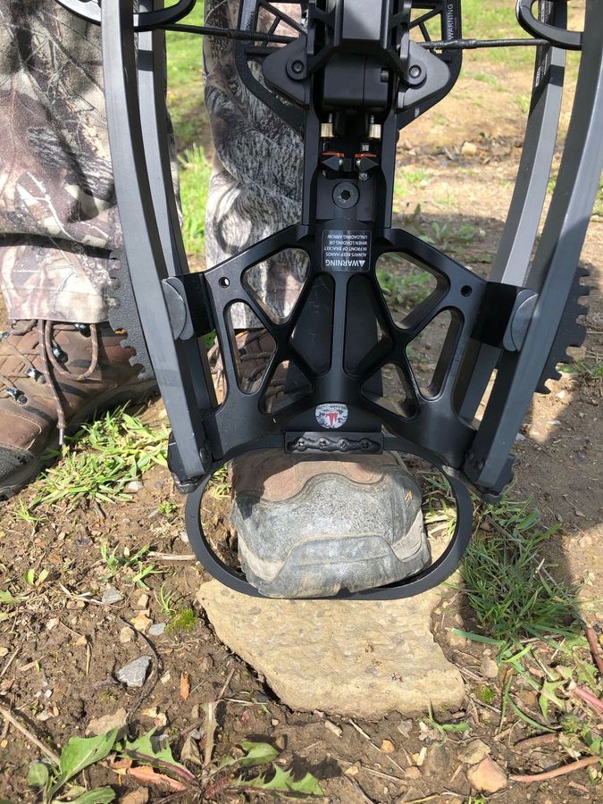 Ravin Crossbow R500 with attached, hanging securely to a hook in a tree.