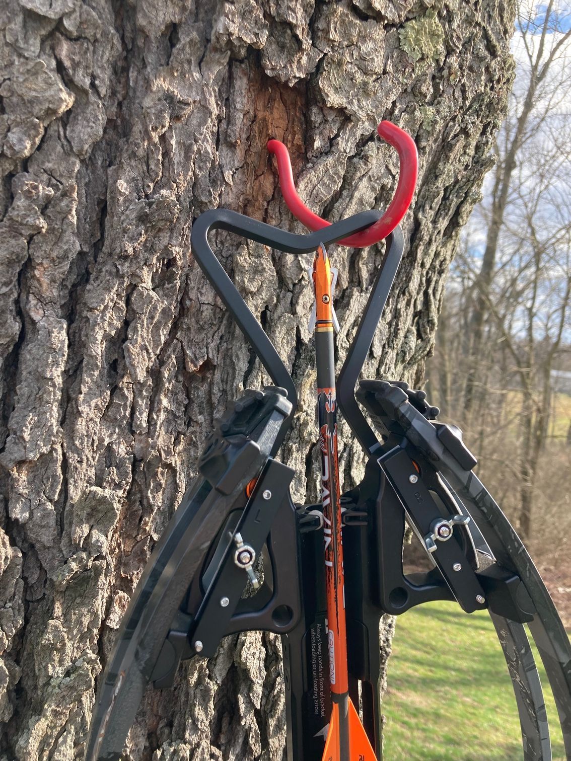 A pair of scissors sitting on top of a wooden table.