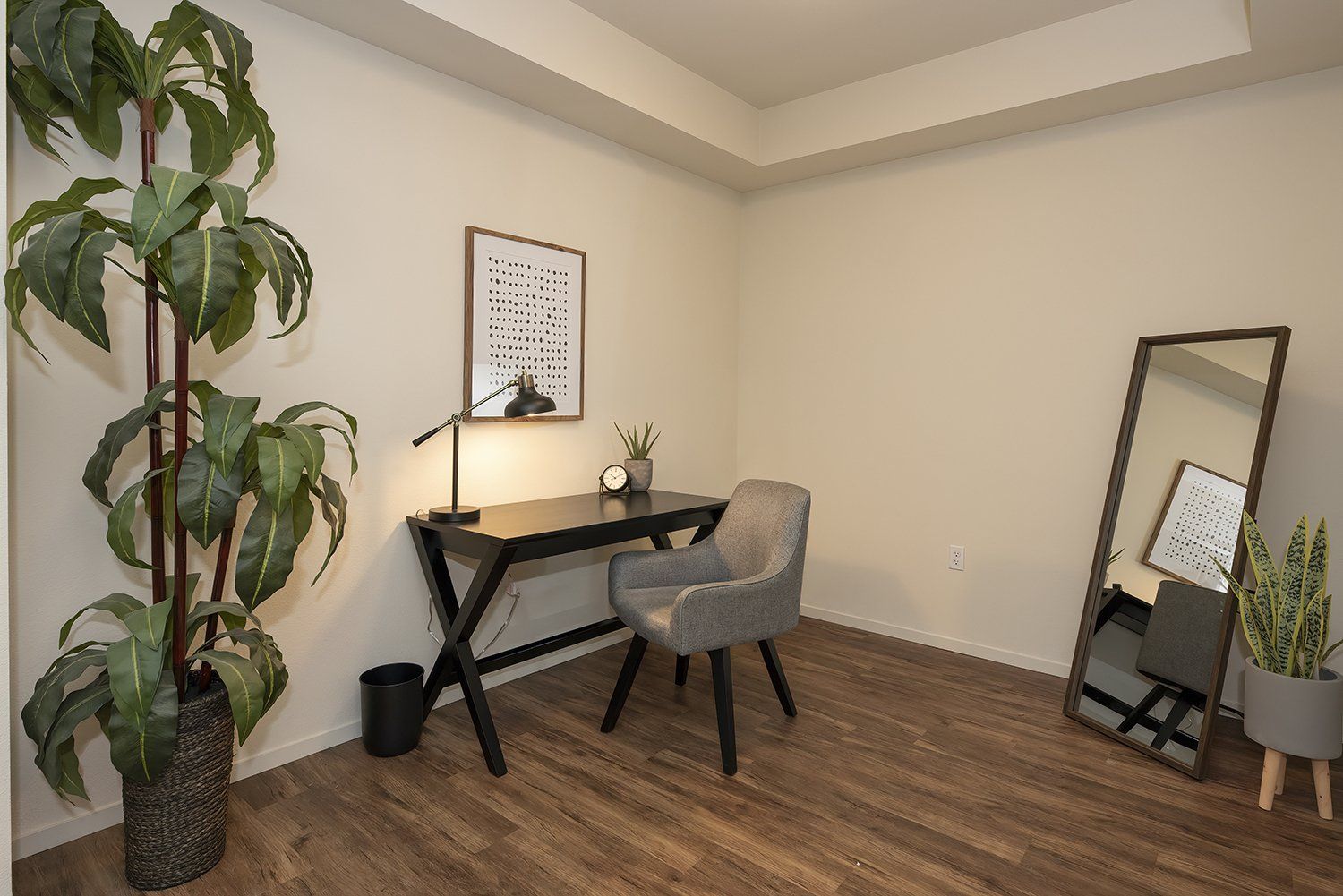 Studios in El Cerrito, CA - Metro 510 - An interior shot of the spare bedroom designed as an office space featuring hardwood-style flooring