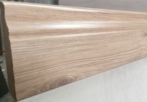 A piece of wood is sitting on top of a table.