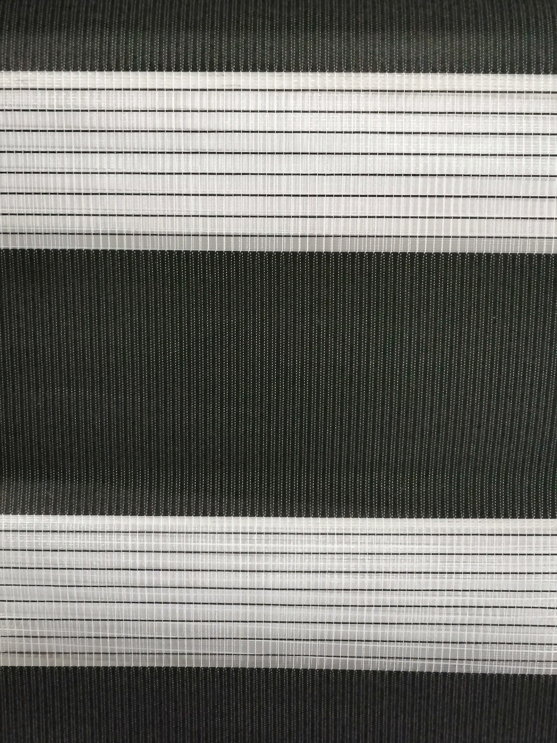 A close up of a black and white striped fabric.