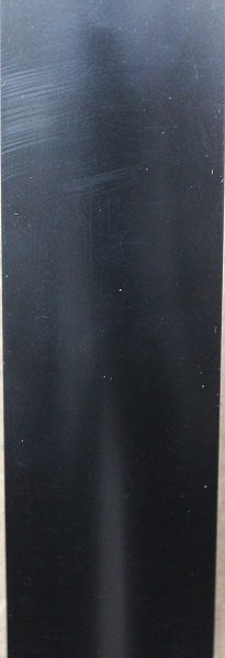 A close up of a black object on a table.