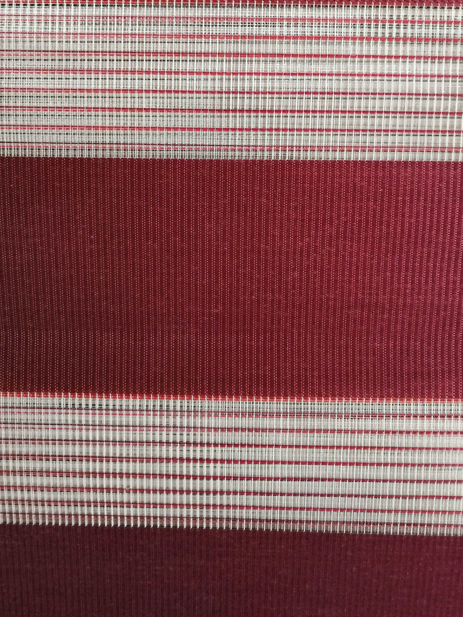 A close up of a red and white striped fabric.