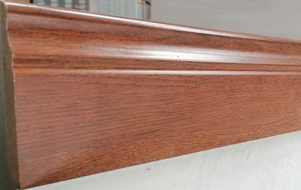 A piece of wood is sitting on top of a white surface.