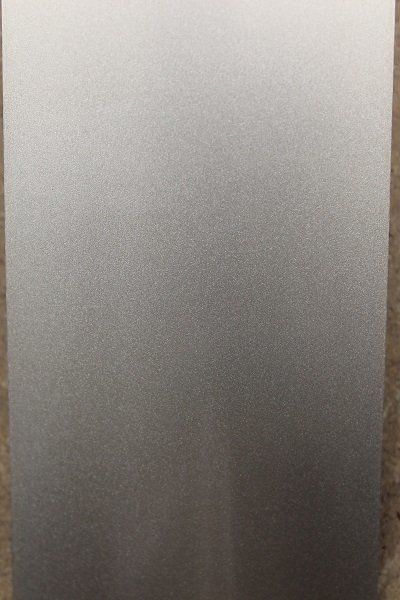 A close up of a gray surface with a grainy texture.