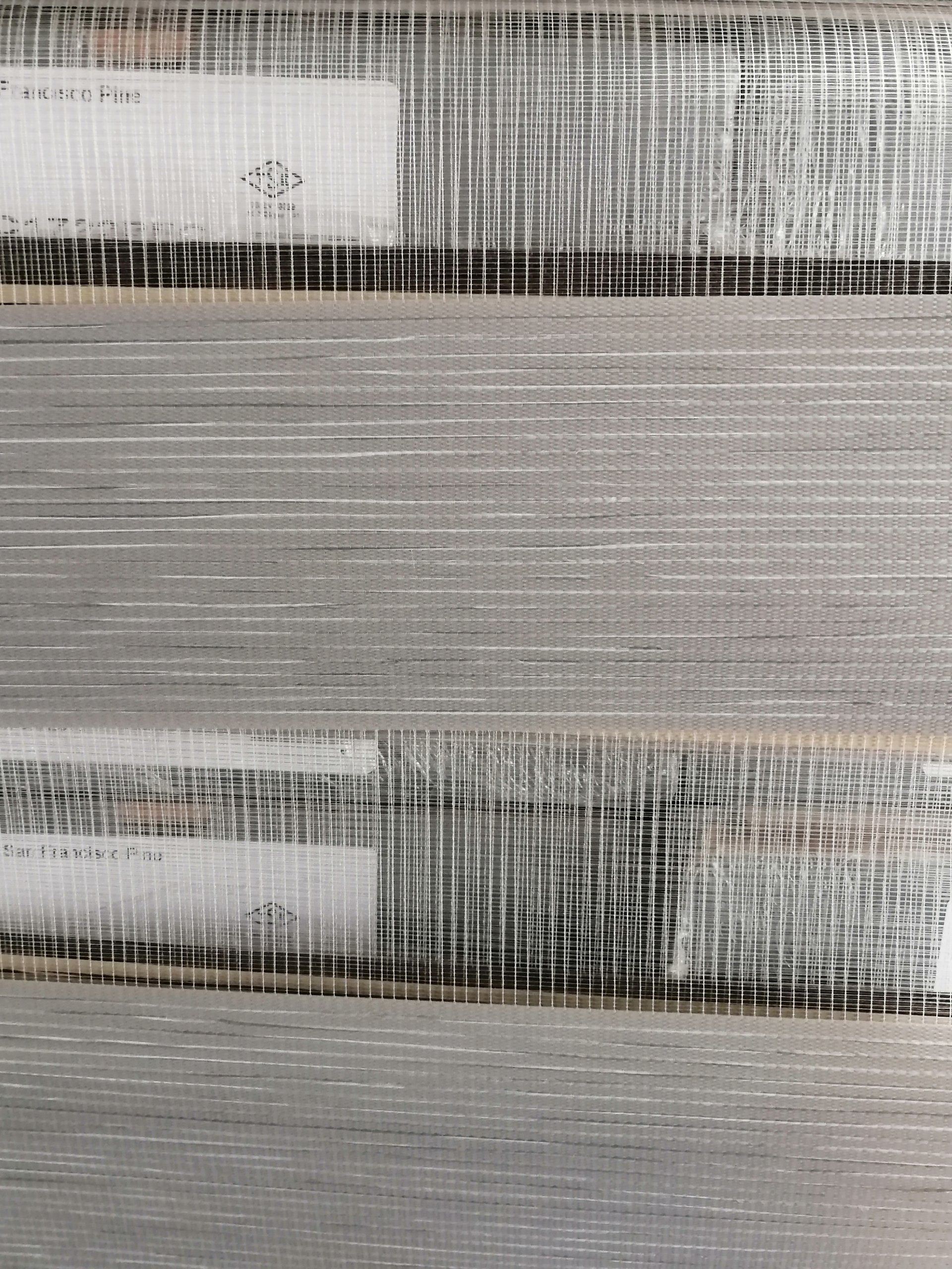 A close up of a gray and white striped fabric.