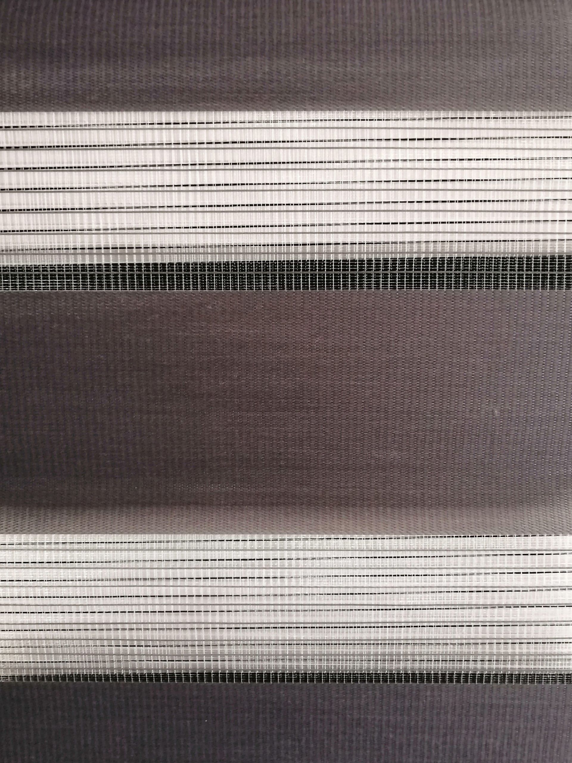 A close up of a gray and white striped fabric.