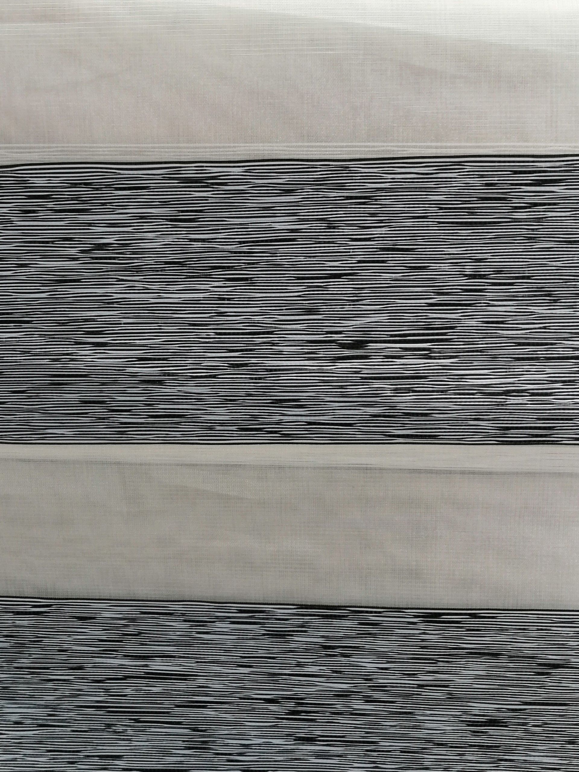 A close up of a black and white striped fabric.