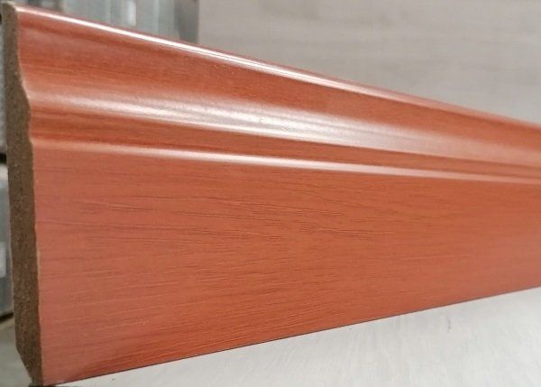A close up of a wooden skirting board on a table.