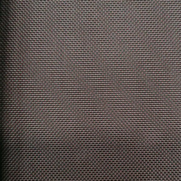 A close up of a piece of fabric with a grid pattern.