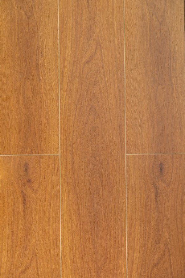 A close up of a wooden floor with a white line between the boards.