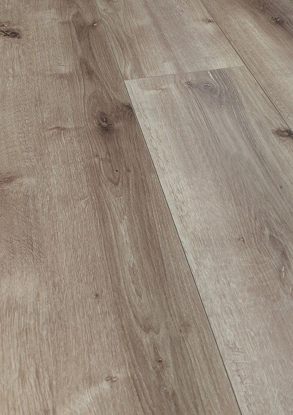 A close up of a wooden floor in a room.