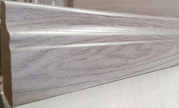 A piece of wood is sitting on top of a table.