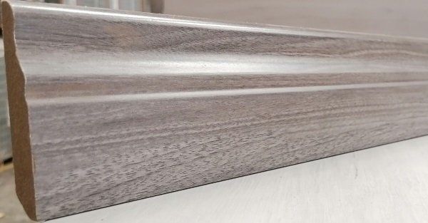 A piece of wood is sitting on top of a white surface.