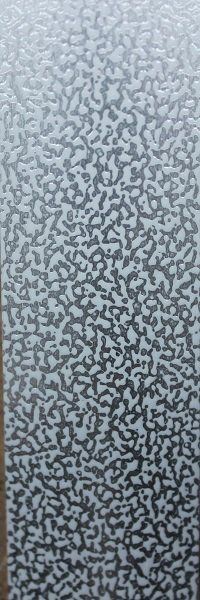 A close up of a gray and white carpet with a pattern on it.