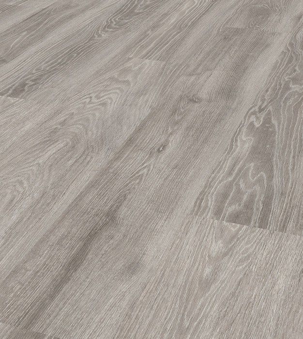 A close up of a gray wooden floor in a room.
