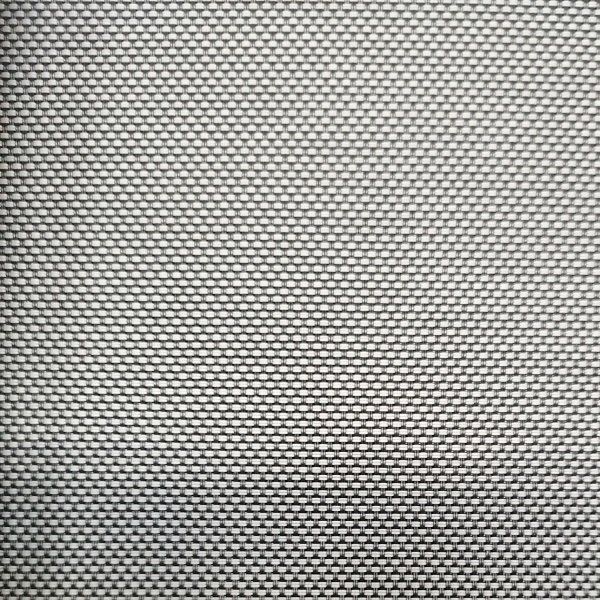 A close up of a white fabric with a geometric pattern.