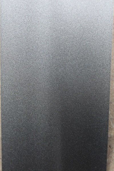 A close up of a gray surface with a grainy texture.