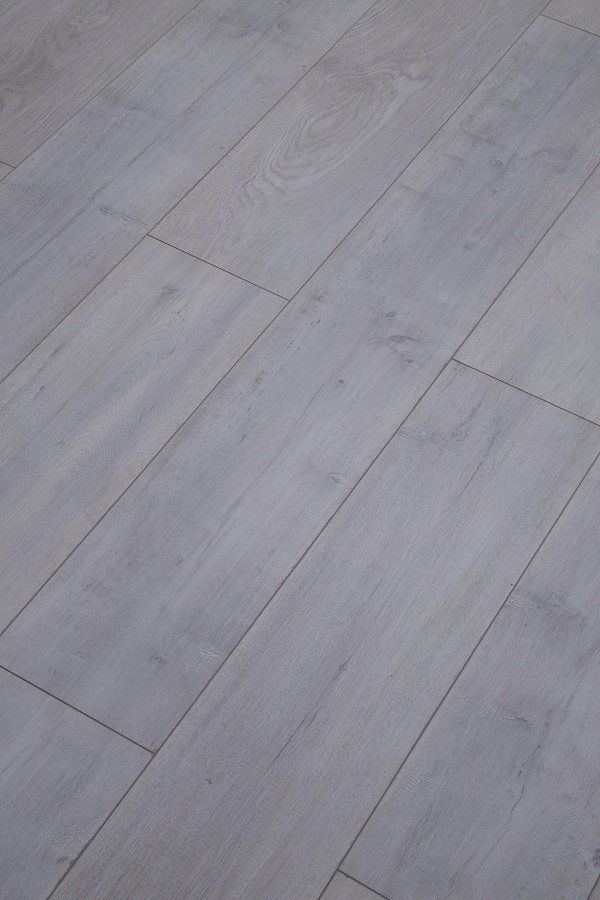 A close up of a gray wooden floor in a room.