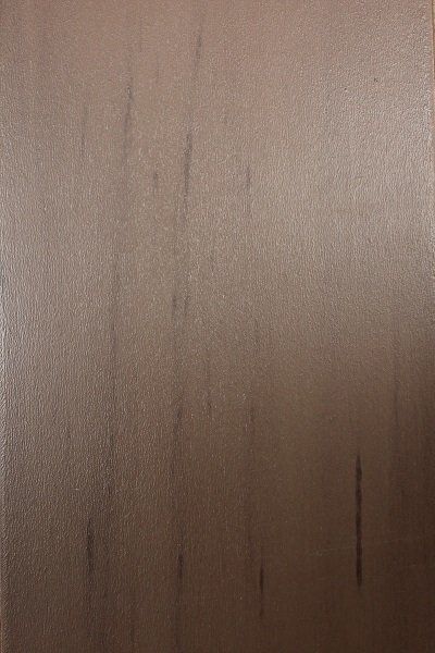 A close up of a piece of wood with a grainy texture.