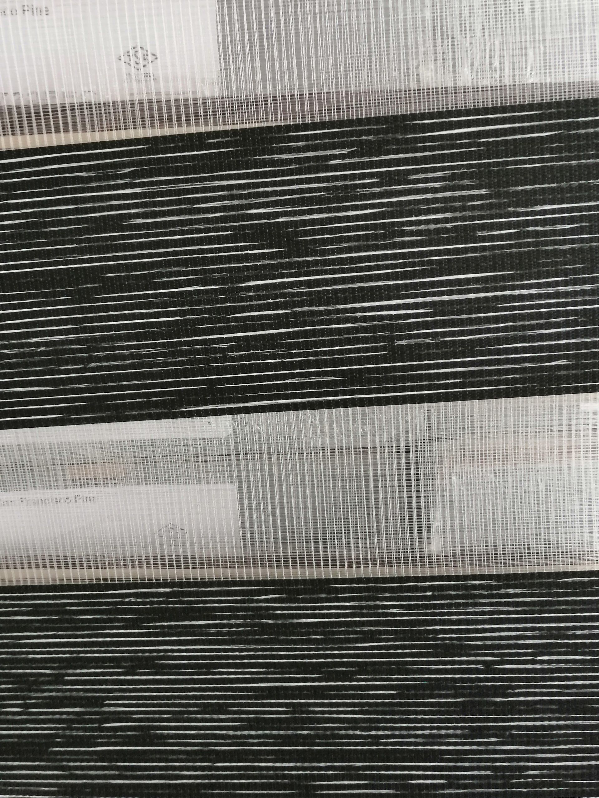 A close up of a black and white striped fabric.