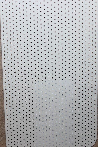 A piece of white paper with black dots on it