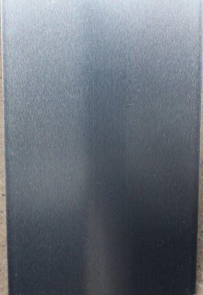 A close up of a black surface with a grainy texture.